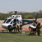 A California Highway Patrol helicopter prepares to depart Tiger Stadium.